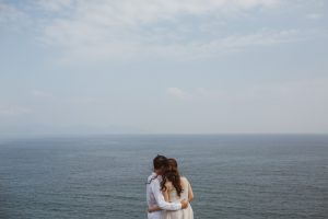 Couple looking towards the sea