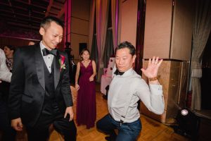 Groom's best friend doing crazy dance at the party