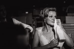 Emotional bride wiping her tears