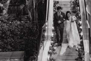 Newlyweds walking down the stairs