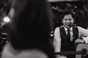 Groom singing a song for the bride
