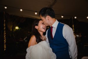 Groom kissing the bride on forehead