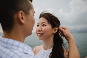 Husband adjusting wife's hair