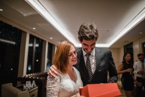 Wedding couple opening a gift