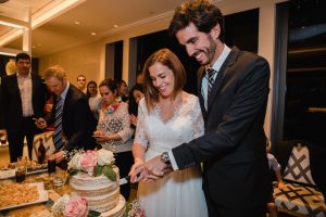 Newlyweds cuttign cake