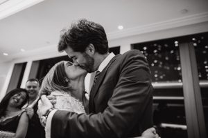 Husband and wife kissing each other