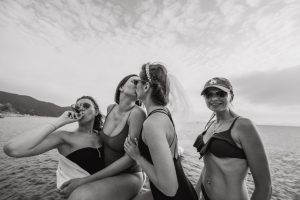 Bride having fun with her girlfriends on a boat ride