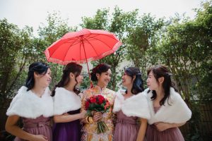 Bride with her bridesmaids on a sunny day