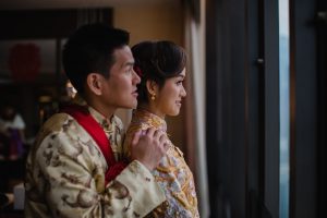 Husband and wife looking out of the window