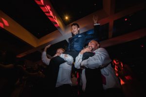 groom dancing with friends