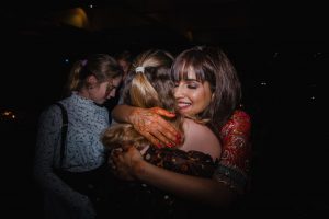 Bride hugging her friends
